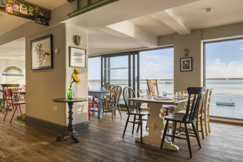 Interior - ground floor restaurant with glass wall to estuary