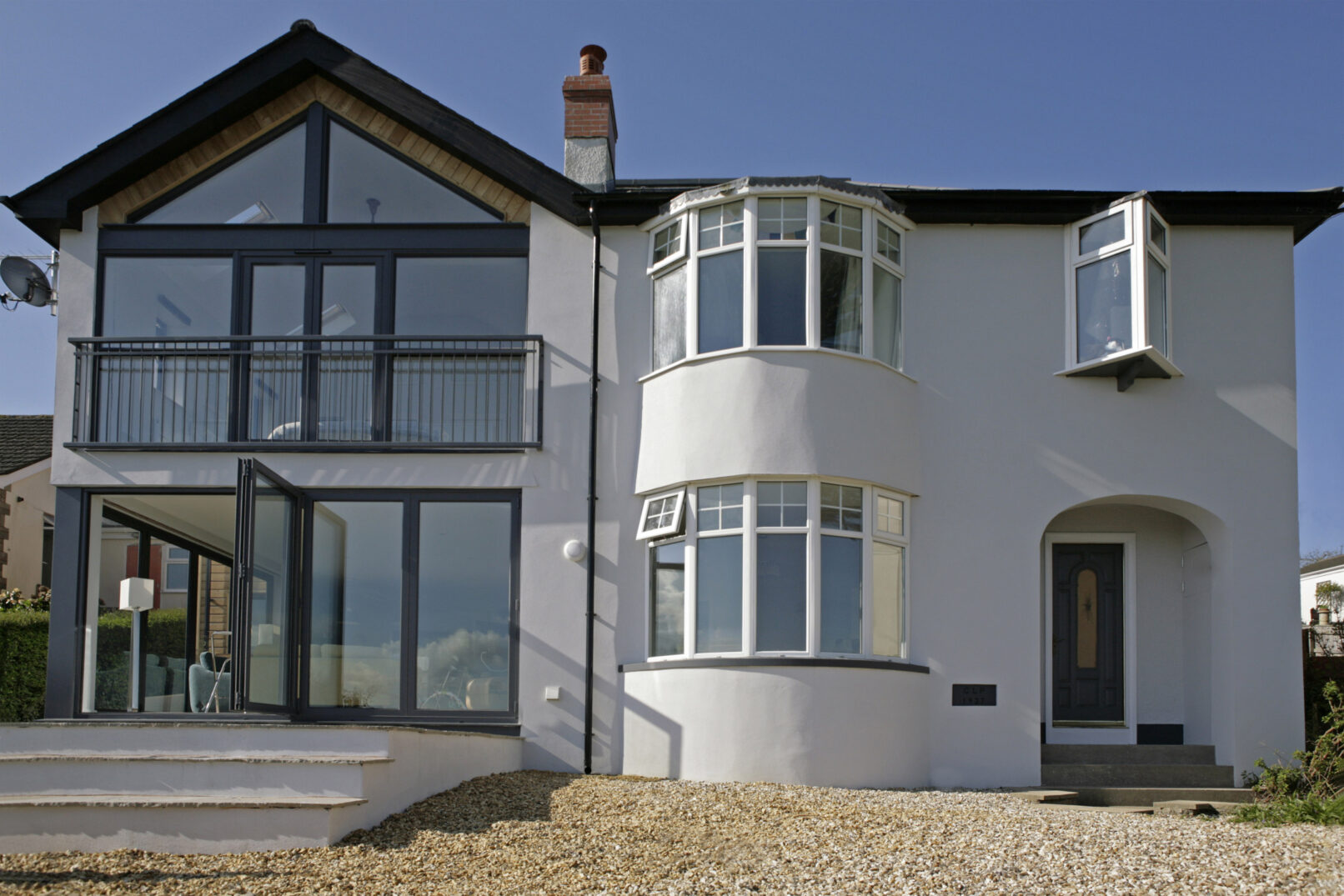 The addition to the left and existing dwelling to the right