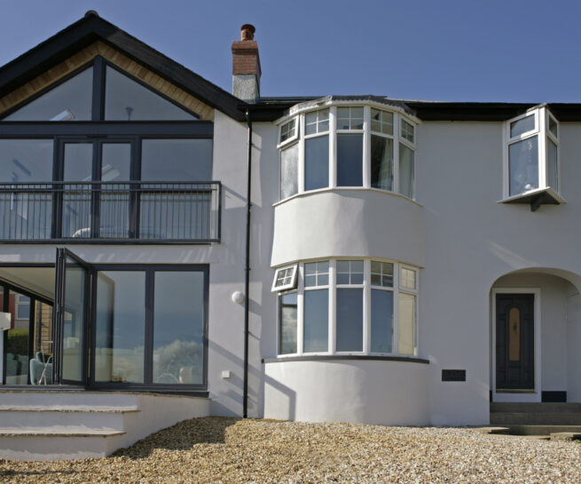 The addition to the left and existing dwelling to the right