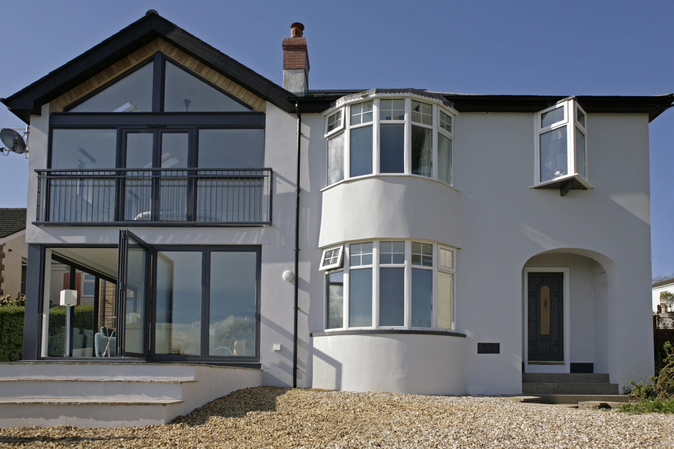 The addition to the left and existing dwelling to the right